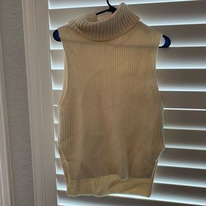 Sleeveless, turtle neck sweater